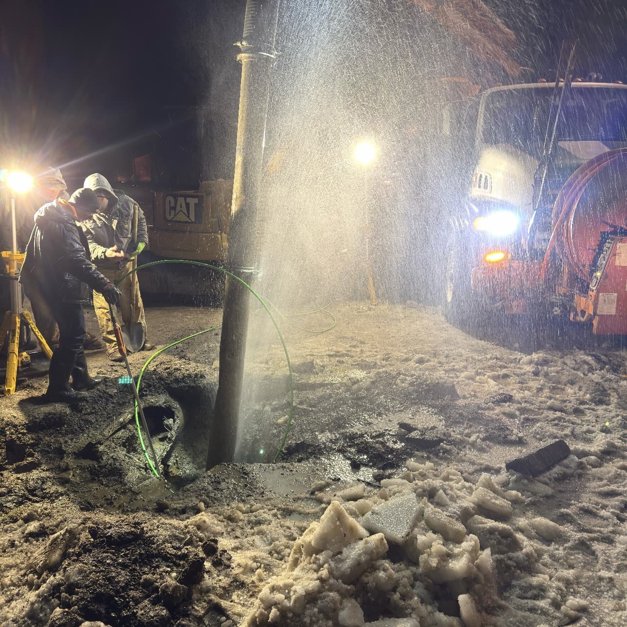 Industrial vacuum truck providing hydro-excavation services on a job site